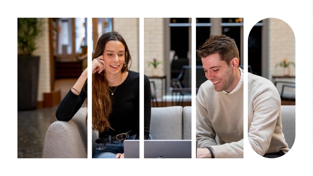 Two employees seated on a couch having a meeting over a laptop.