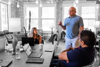 Kris Snyder of Ninety speaking to his team during a meeting.