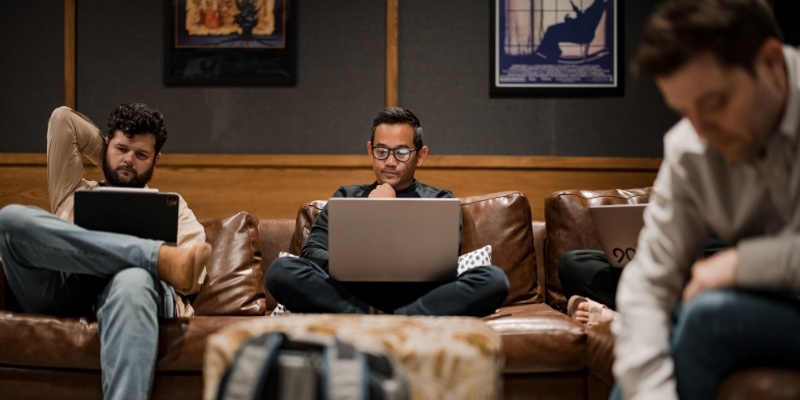 Ninety employees working on their laptops